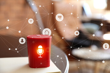 Smart home assistant device on table in room