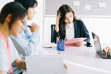 The business team members are discussing next month's plans together