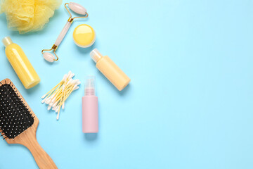 Travel cosmetics set on color background