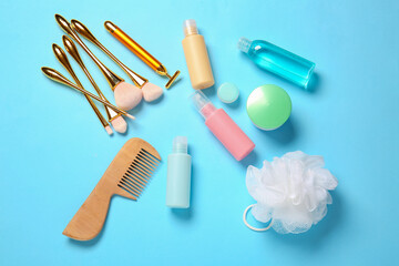 Travel cosmetics kit on color background