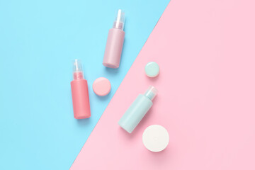 Set of travel bottles with cosmetic products on color background