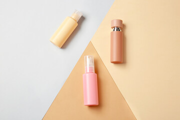 Travel cosmetics kit on color background