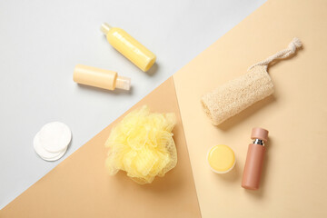 Travel cosmetics kit on color background