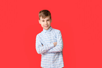 Cute smiling boy on color background