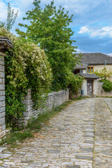 Traditional architecture with  narrow  street and stone buildings a in Vitsa village  central Zagori Greece