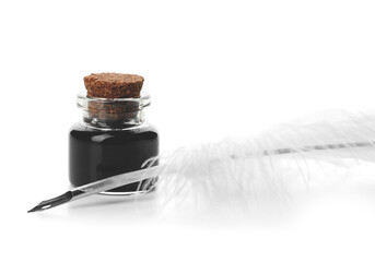 Feather pen and inkwell on white background