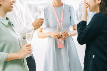 Group Asian business people are having a toast together and chatting at a company party