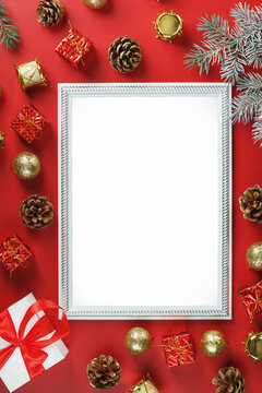 The layout of the frame with the free white space on a red background and Christmas decorations.