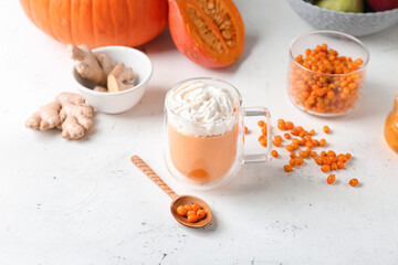 Glass cup of tasty pumpkin smoothie on white background
