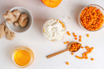 Glass cup of tasty pumpkin smoothie on white background
