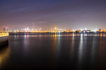 Fototapeta na wymiar Shot of a Dubai city skyline at night from Dubai creek harbour. UAE. Outdoors
