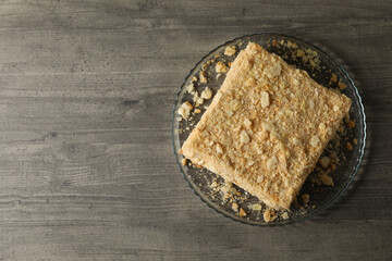 Tray with delicious Napoleon cake on gray table