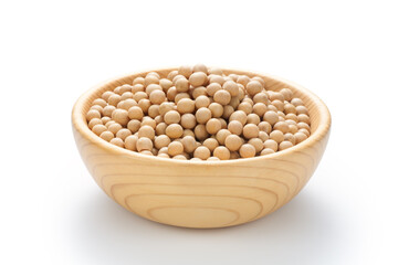 Soybean seeds in a wooden bowl isolated on white background