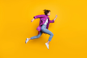 Full length profile side photo of trendy beautiful girl run jump copyspace sale isolated on shine yellow color background