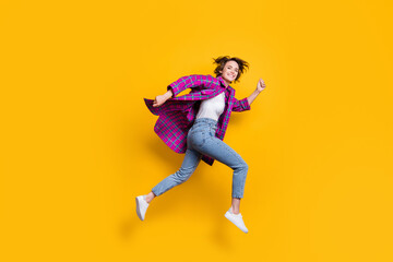 Full size profile side photo of brown bob curly haired woman run fast jump up sale isolated on yellow color background