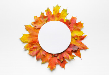 Beautiful autumn composition with leaves and blank card on white background