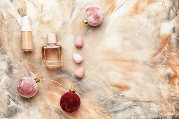 Christmas composition with cosmetics on color background