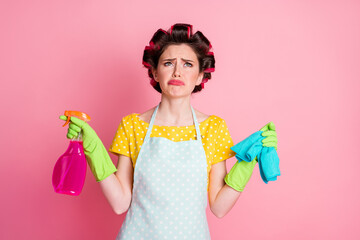 Frustrated girl hold bottle sprayer rag cry look up copyspace isolated pastel color background