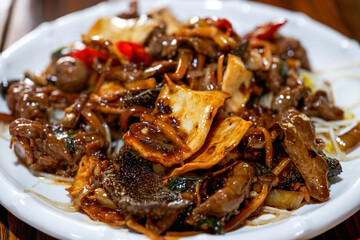 A delicious Chinese Guangxi dish, old friend's hot and sour fried beef offal