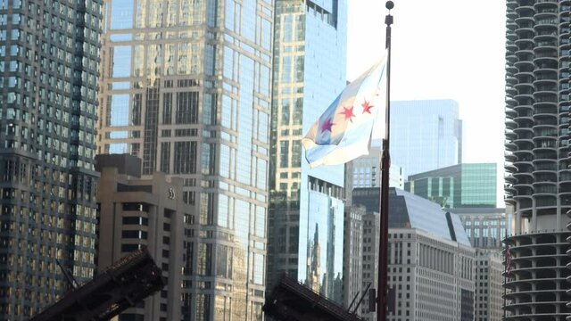 illinois flag in a bridge in chicago river, downtown