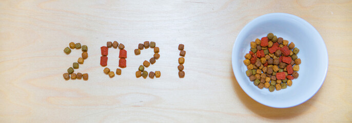 food for cats and dogs and the new year. Dry food label. Pet treats in 2021