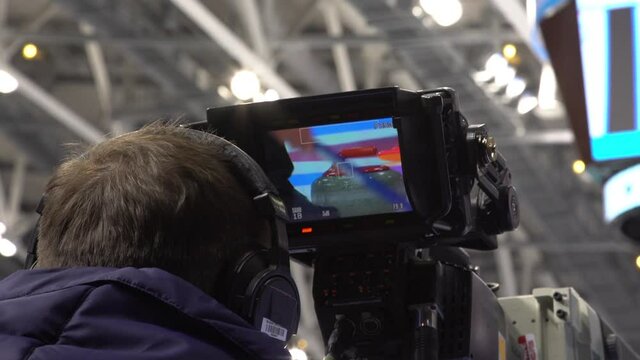 A special video camera for broadcasting a sports match. Video broadcast of a sporting event. Curling.  Olympic sport.  Curling stone.