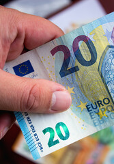 Euro currency close up in the hands of a rich man