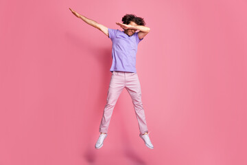 Full length photo of brown haired bristled sportive guy jump up dab cover eyes wear pink trousers...