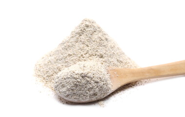 Barley flour pile with wooden spoon isolated on white background