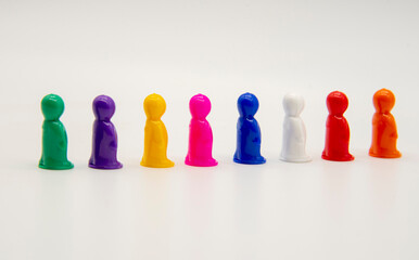 Miniature toy figures stand in formation on a white background.