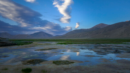 Panorama during blue hour before sunrise of high-altitude Bulunkul village surroundings off the Pamir Highway in Gorno-Badakshan, Tajikistan
