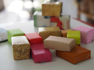 Stacked gift boxes wrapped in multi colored paper, Festival Gifts for Christmas and Happy New Year