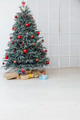 Red decor new year interior Christmas tree with gifts