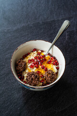 Amaranth Chocolate and Granola with Yogurt, Honey, Pomegranate Seeds. Yoghurt.