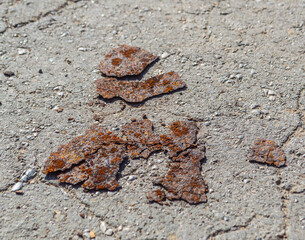 Pieces of rust on the pavement texture
