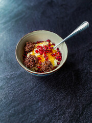 Amaranth Chocolate and Granola with Yogurt, Honey, Pomegranate Seeds. Yoghurt.
