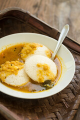 Idli and sambar served in a white bowl. A healthy, traditional breakfast cuisine from southern india.