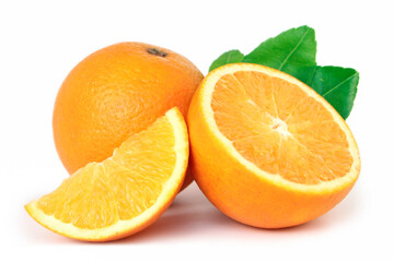 Orange fruit with orange slices and leaves isolated on white background.