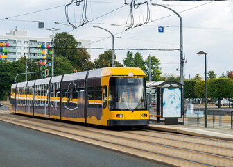 Fototapeta na wymiar Modern yellow tram in Dresden