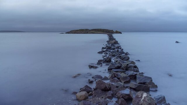Dramatic time lapse video of  rocky path leading to an island. Southern Norway