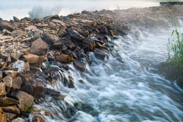 Falling water from stone path