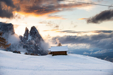 Amazing winter landscape at sunset in Alpe di Siusi, Dolomites, Italy - winter holidays destination