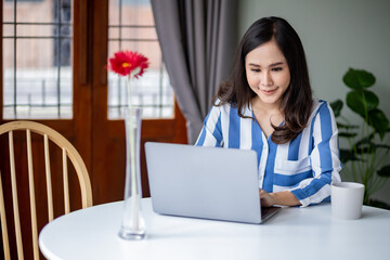 Asian woman made meeting online by using laptop