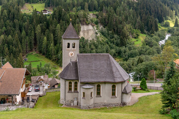 Aerial view of the catholic church of Gomagoi, South Tyrol, Italy