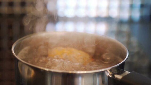 Eggs boiling in the pot in slow motion 180fps