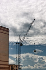 Close-up facade of a multi-apartment brick residential building under construction. Brick building under construction close-up.