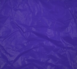 crumpled purple plastic bag background