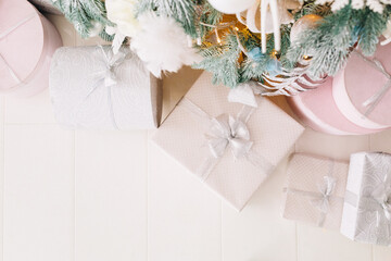 Fototapeta na wymiar beautiful Christmas decorations and gifts under the Christmas tree 