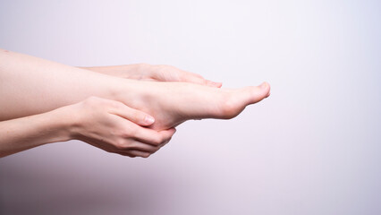 massage of leg muscles with hands, unpleasant pain in the legs