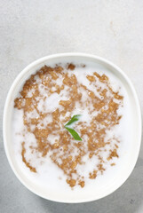 Jenang bubur abang or red brown sweet porridge with coconut milk. Cook and shared to neighbor for celebrate weton date birthday people from javanese culture.